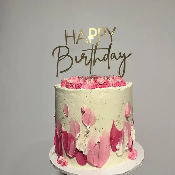 Pink ombre birthday cake with buttercream petals