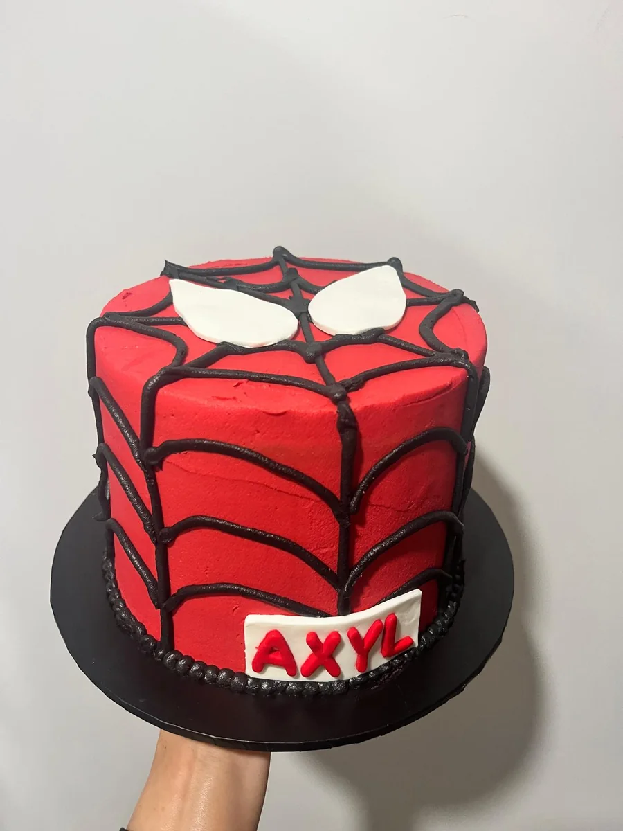 Red Spider-Man character cake with piped web detail