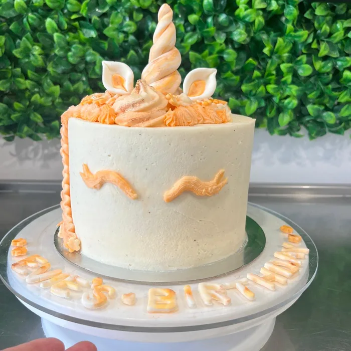 Unicorn cake with buttercream mane and gold horn