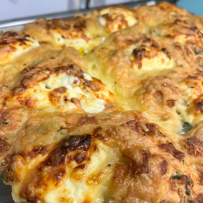 Tray of freshly baked golden cheese scones