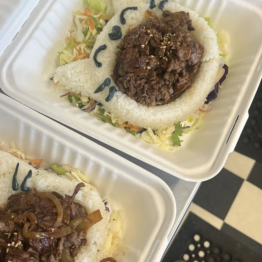 Korean-style beef and rice boxes with slaw prepared as individual catering portions