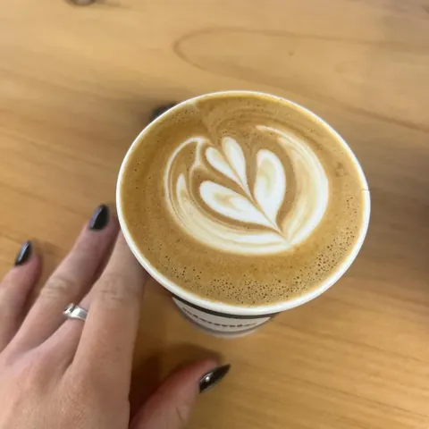 Latte art on an Atomic coffee flat white at Mini Misfits cafe