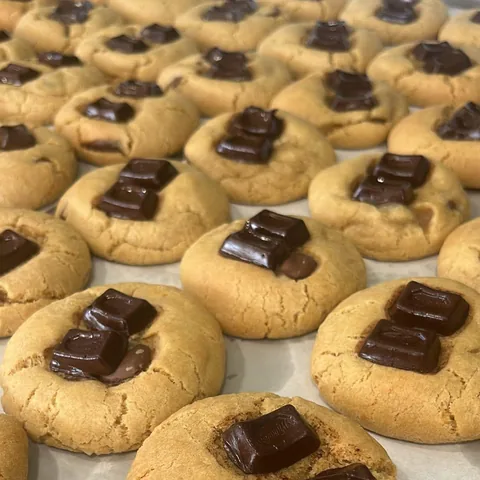Freshly baked choc chunk cookies topped with chocolate